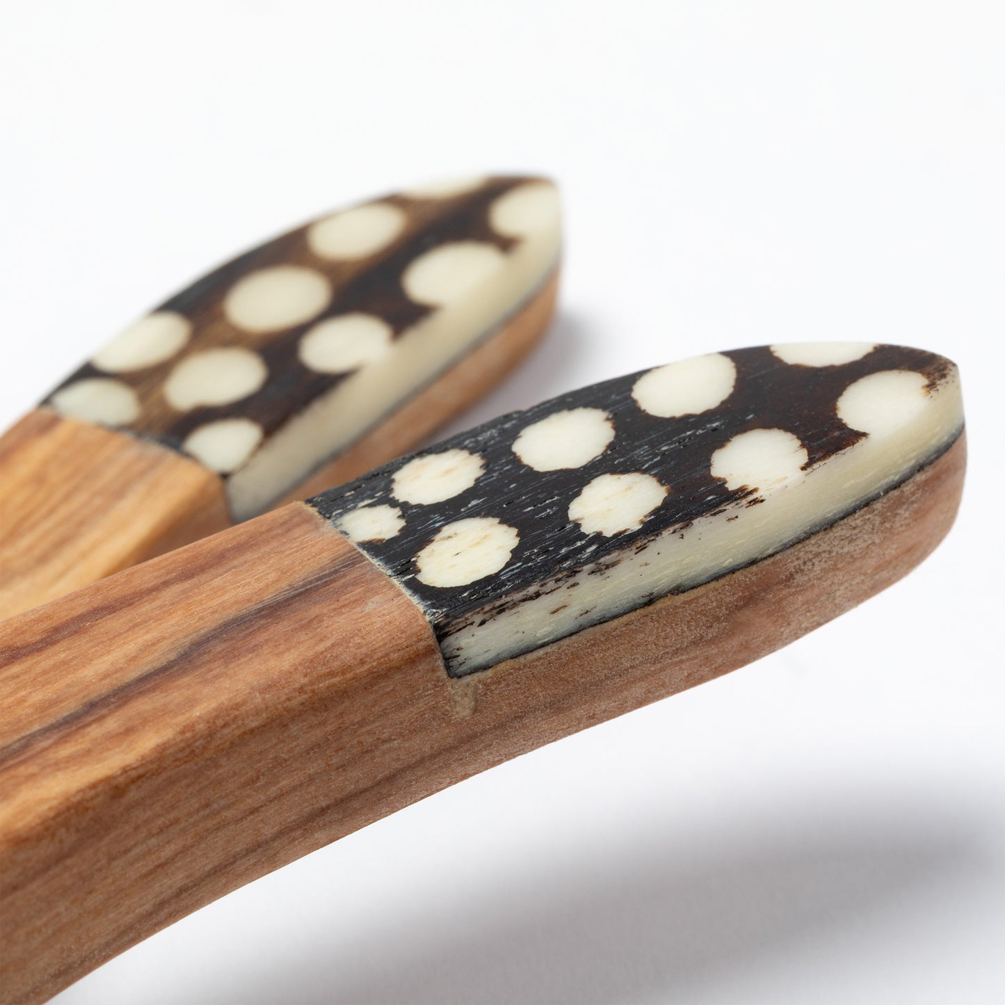 Olive wood handles with decorative bone inlay detail.