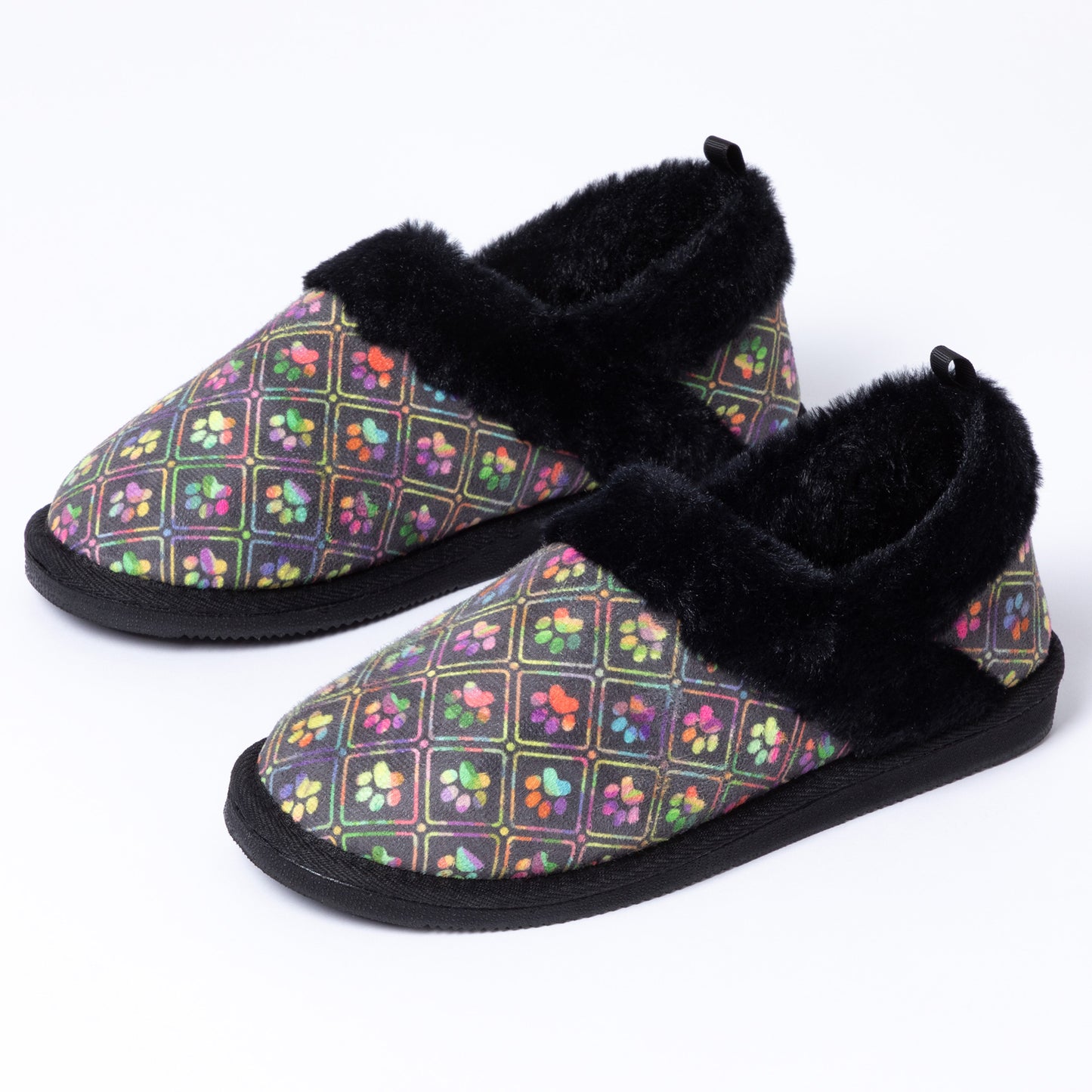 Black faux fur lined slipper shoes with a colorful paw print design on a white background.
