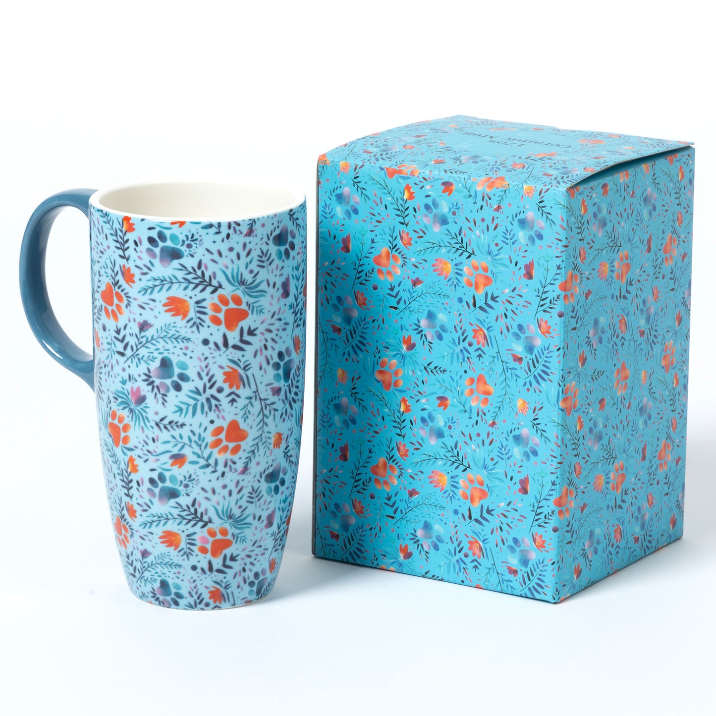 Colorful floral mug next to a matching patterned gift box.