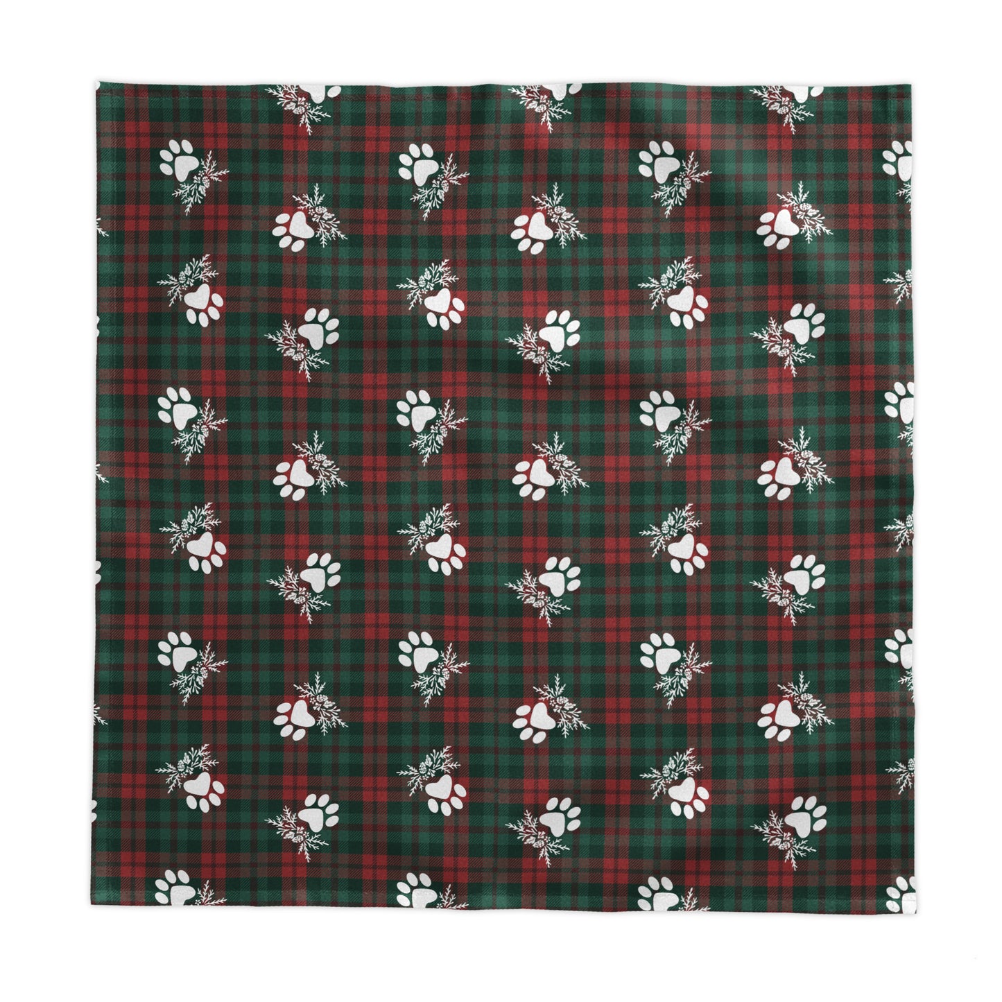 a green and red plaid tablecloth with white paw prints on a white background