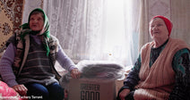 Elderly Ukrainians Share Heartbreaking Survival Stories While Receiving Donated Blankets