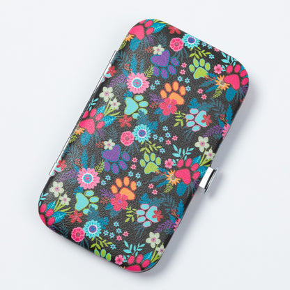 A rectangular metal case with rounded corners, featuring a vibrant multicolor floral and paw-print pattern on a black background, shown on a light gray background.