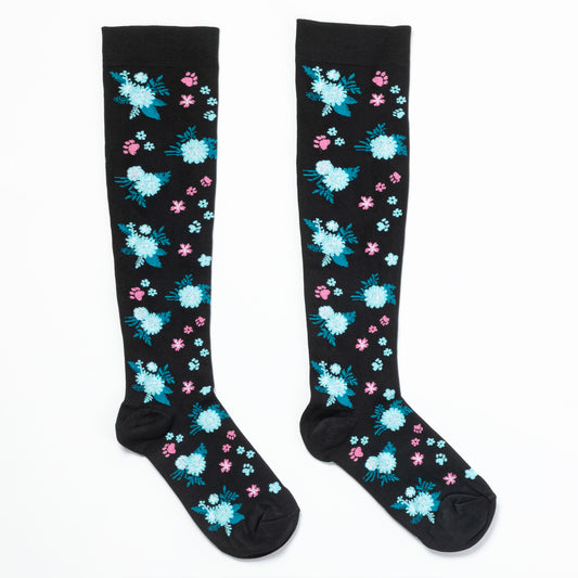Black knee-high compression socks with floral pattern and paws on a white background.