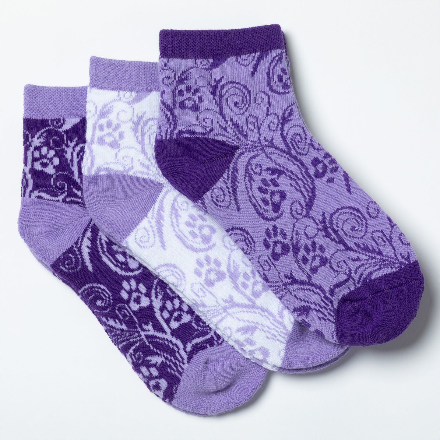 Each design included in the flourish paws purple set of three ankle-length socks.