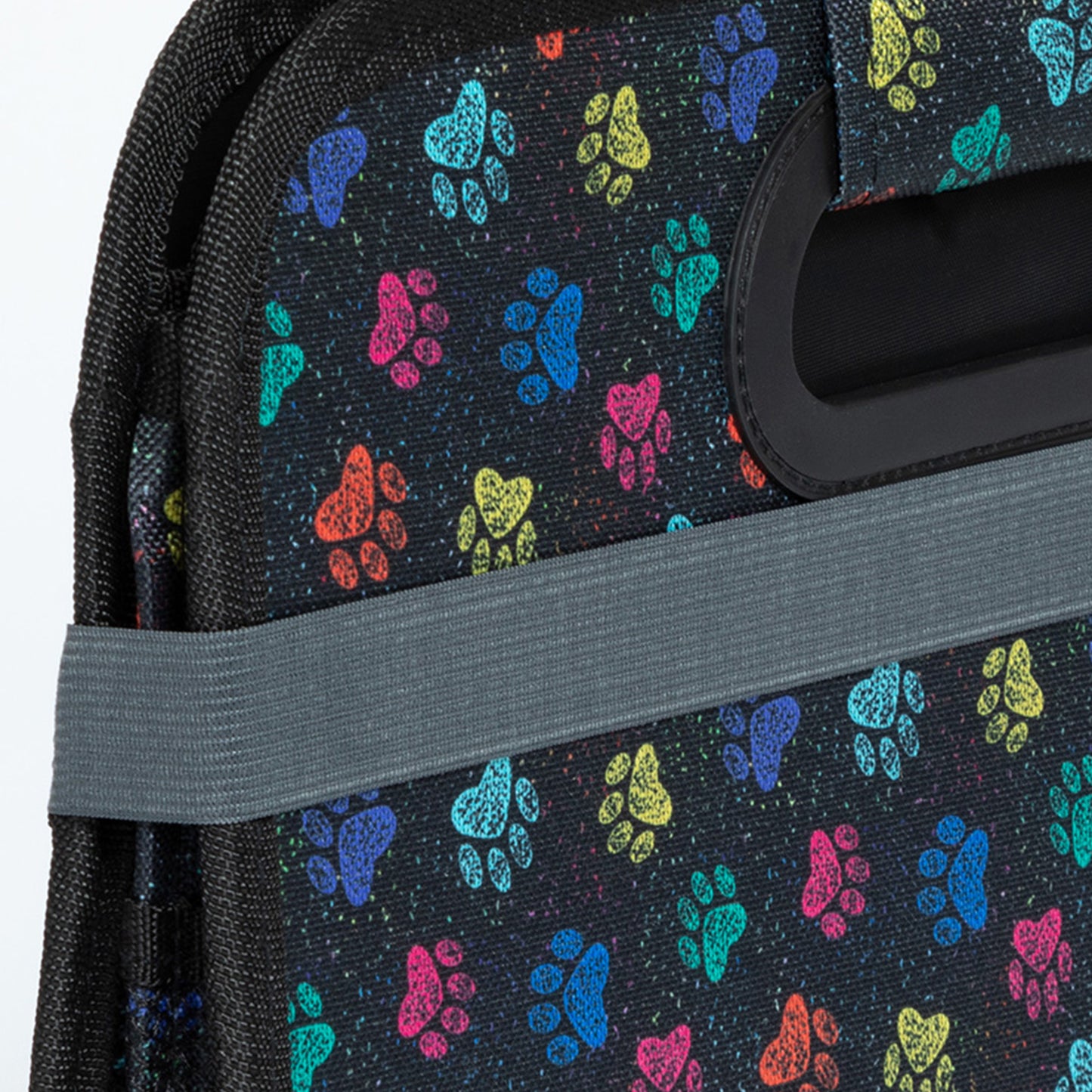 Close up of black trunk organizer with colorful paw print pattern on a white background
