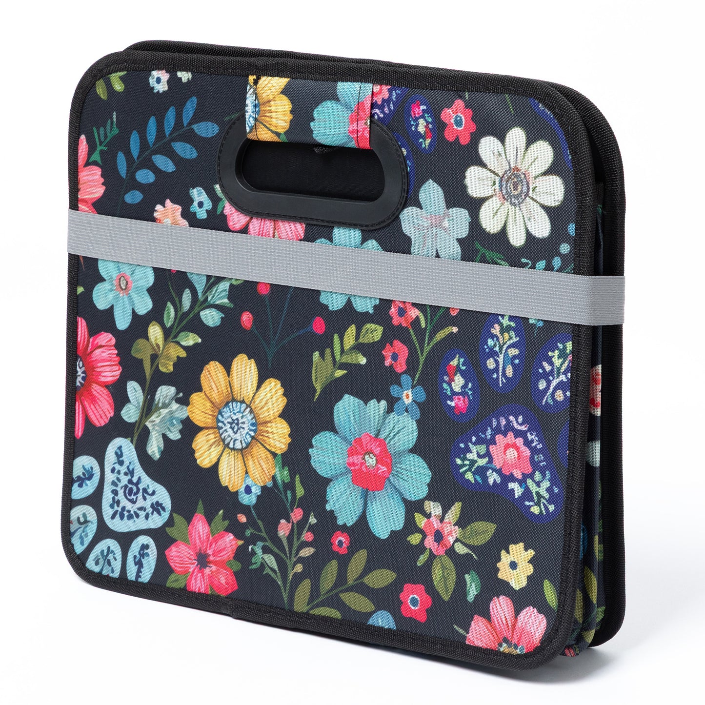 Floral-patterned trunk organizer with a handle on a white background