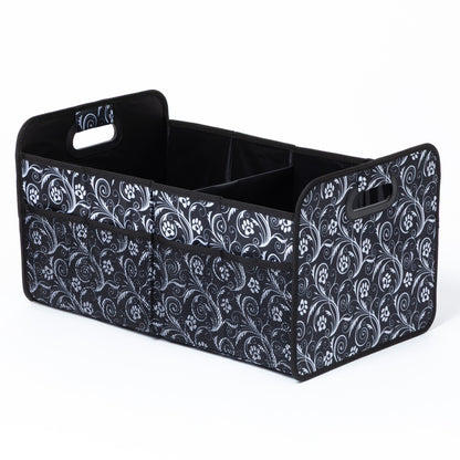 Black and white patterned storage bin with handles on a white background