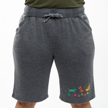 Gray shorts with colorful dog designs on a white background