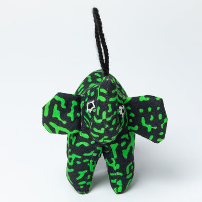Plush elephant ornament with green and black pattern on a white background