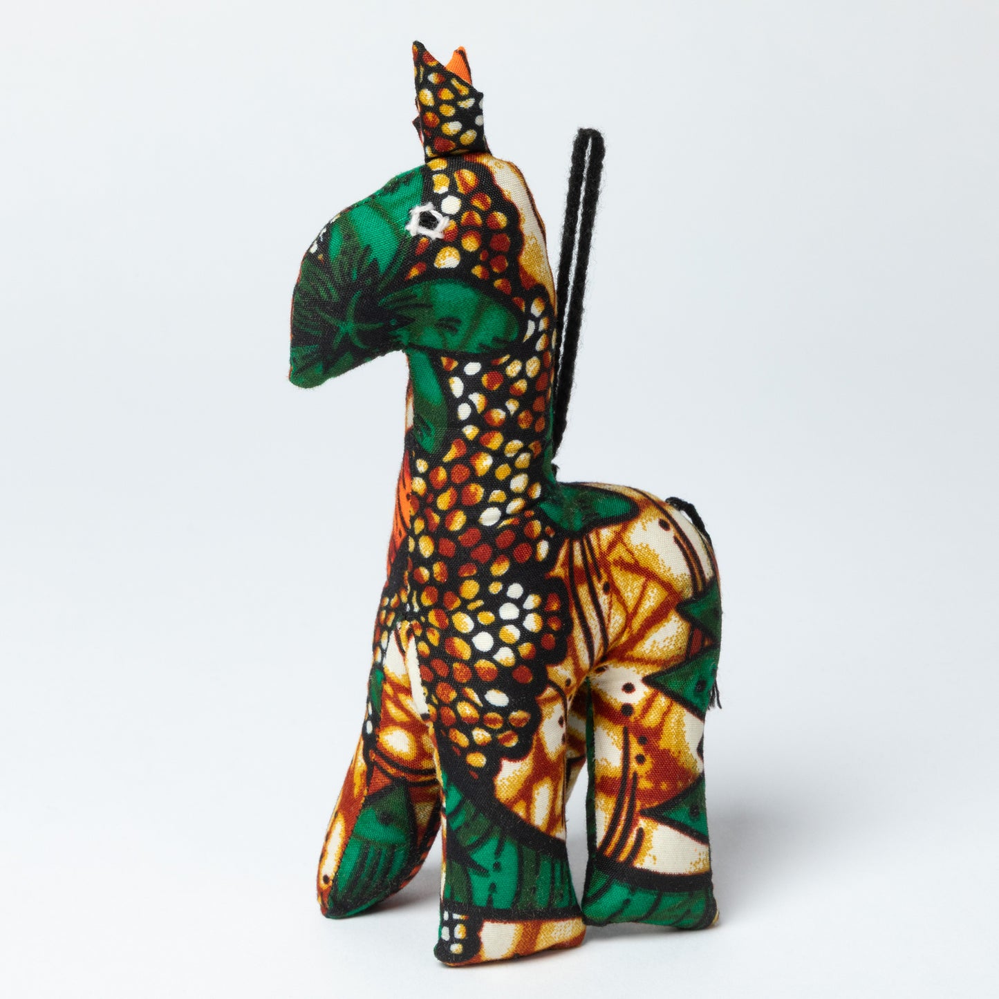 Decorative giraffe plush ornament with a colorful pattern on a white background