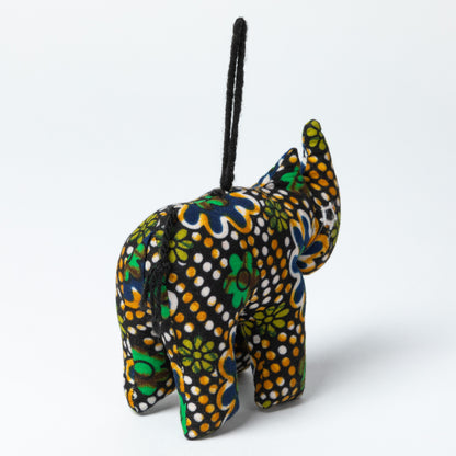 Colorful rhino-shaped ornament with patterns on a white background