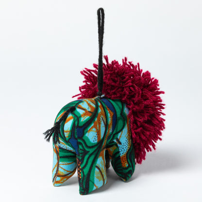 Colorful elephant ornament with a red mane on a white background