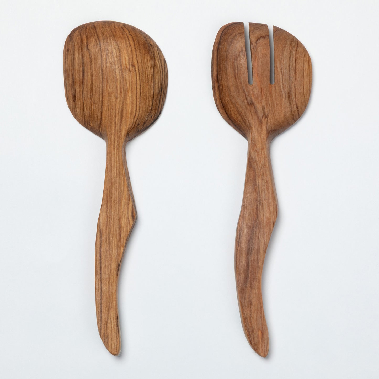Wooden spoon and fork salad server set with decorative handles on a white background