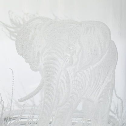 White elephant silhouette on a clear glass on a white background