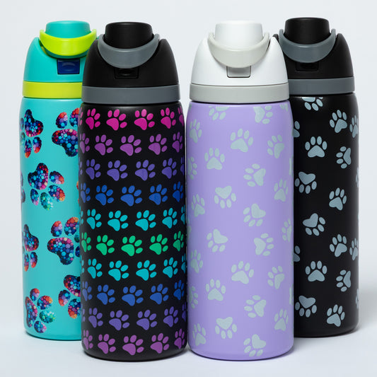 Four colorful water bottles with paw pattern designs on a white background