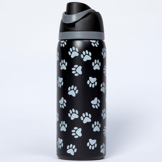 Black water bottle with white paw prints on a white background