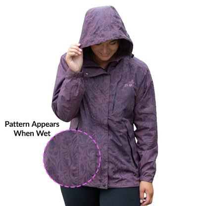 Woman wearing a purple raincoat with a pattern that appears when wet, on a white background.