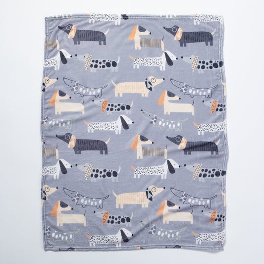 A soft pet blanket with cute dog pattern all over.