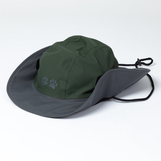 Green and gray hat with a paw print on a white background