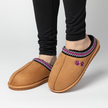 Tan clog slipper shoes with patterned trim and paw print on a white background.