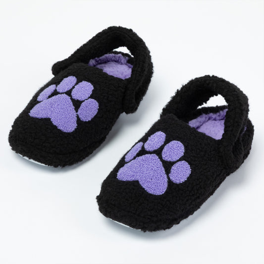 Pair of black fuzzy slippers with purple paw prints on a white background