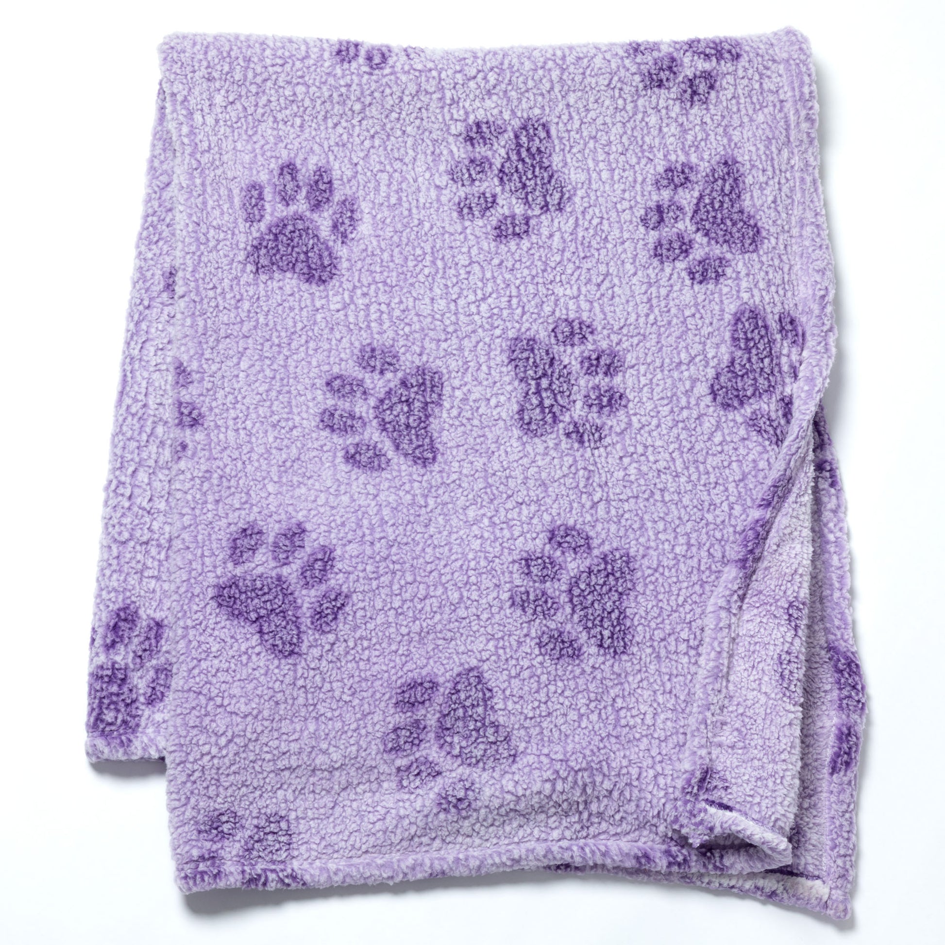 A lavender purple plush fleece blanket with a repeating dark purple paw print pattern, folded neatly on a white background.
