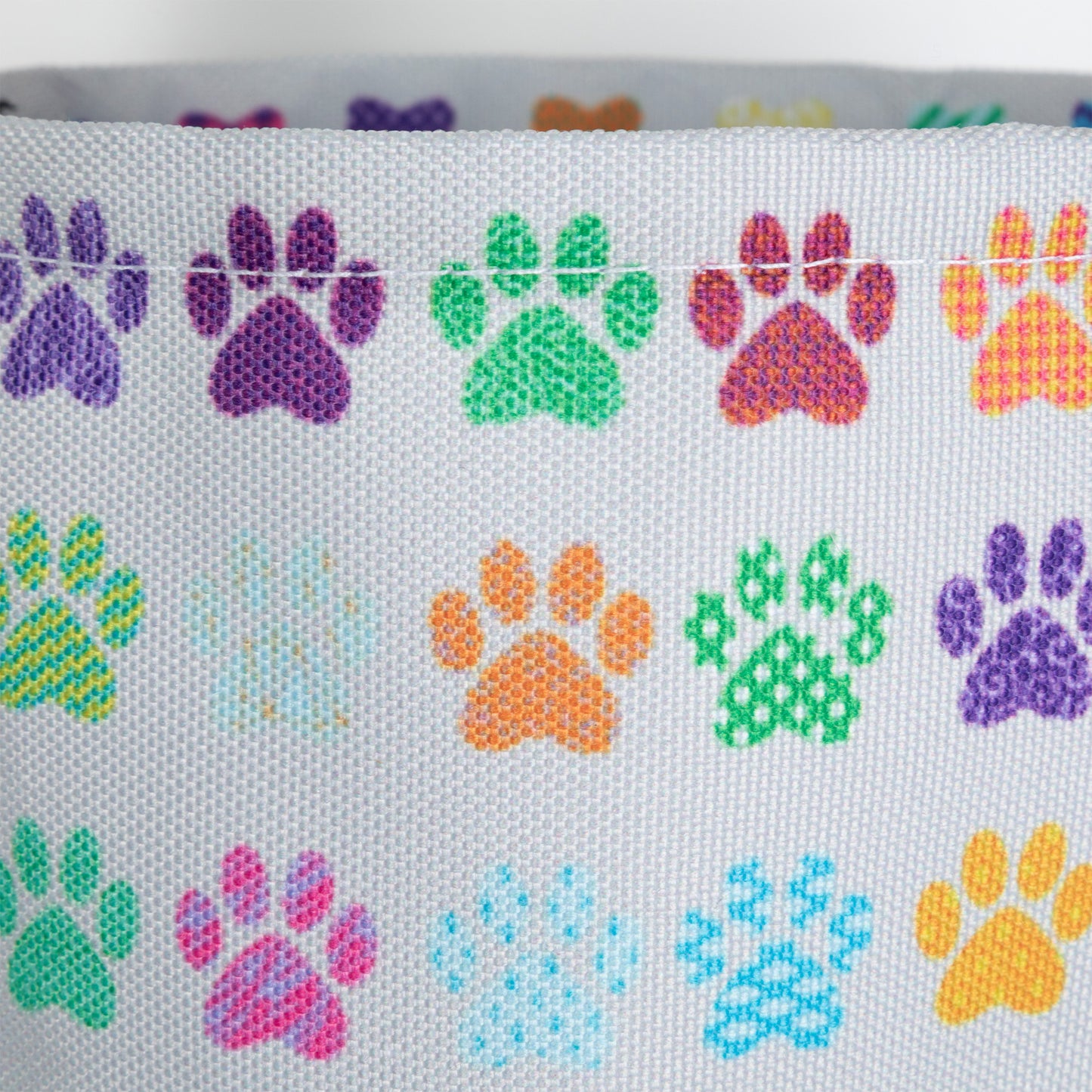 Close up of paw print design on collapsible car trash can