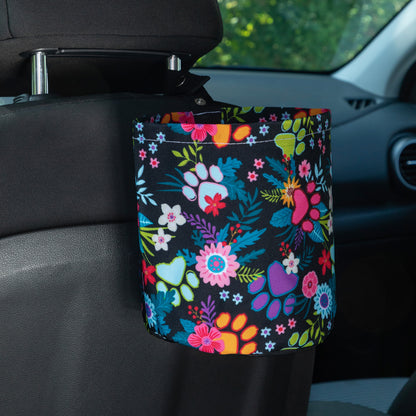 Floral-patterned car garbage holder attached to a car seat.