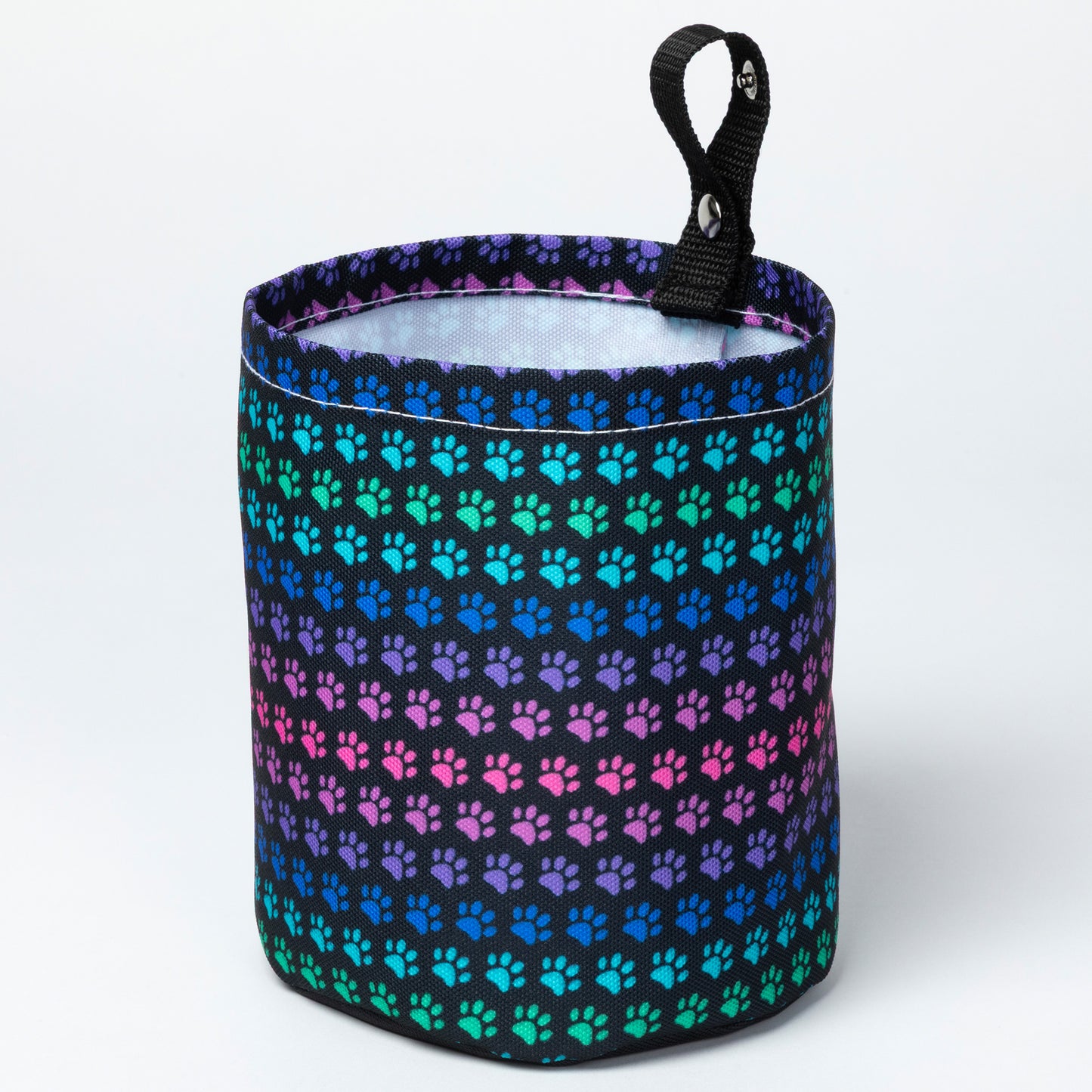 Collapsible car garbage holder cover with rainbow paw pattern. 