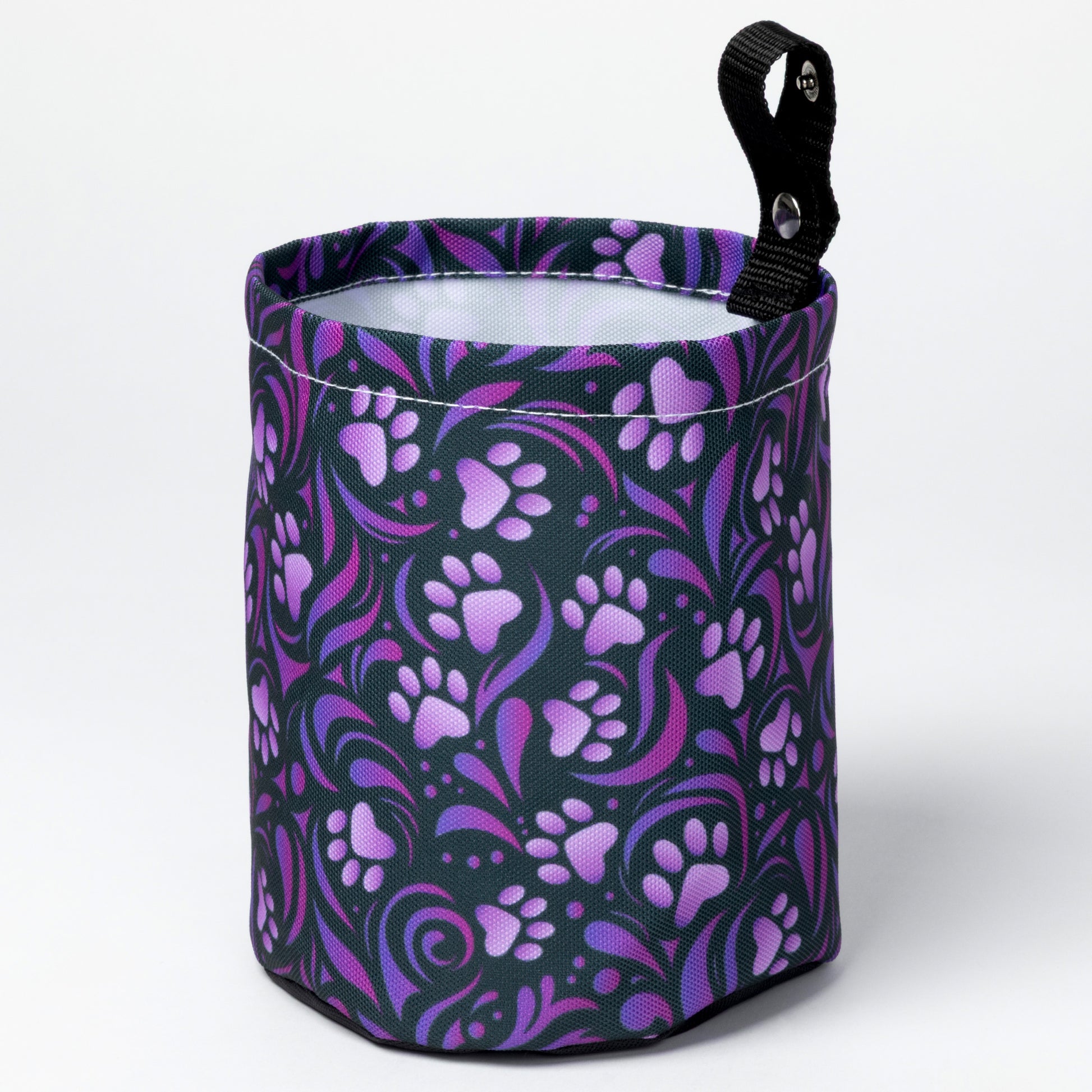 Collapsible car garbage holder with purple paw print pattern on a white background