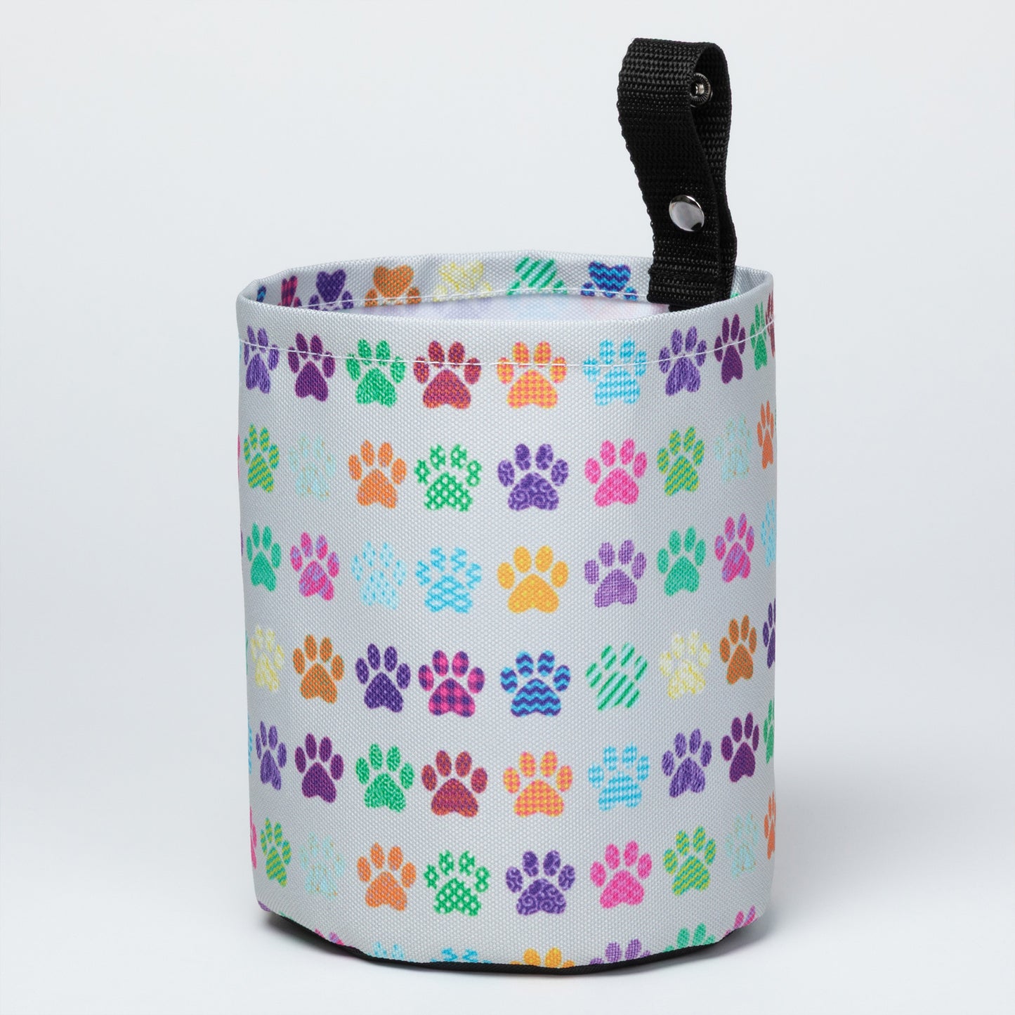 Collapsible car garbage holder with multicolor paw print pattern on a white background