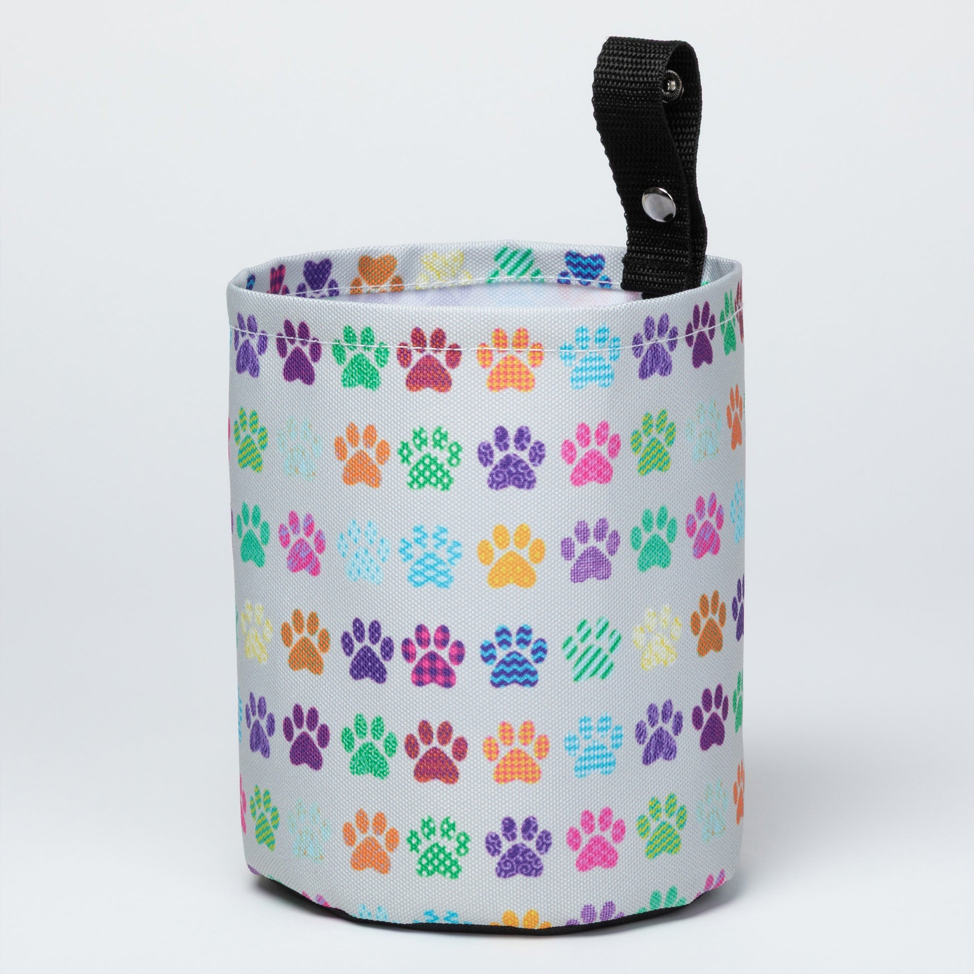Collapsible car garbage holder with multicolor paw print pattern on a white background