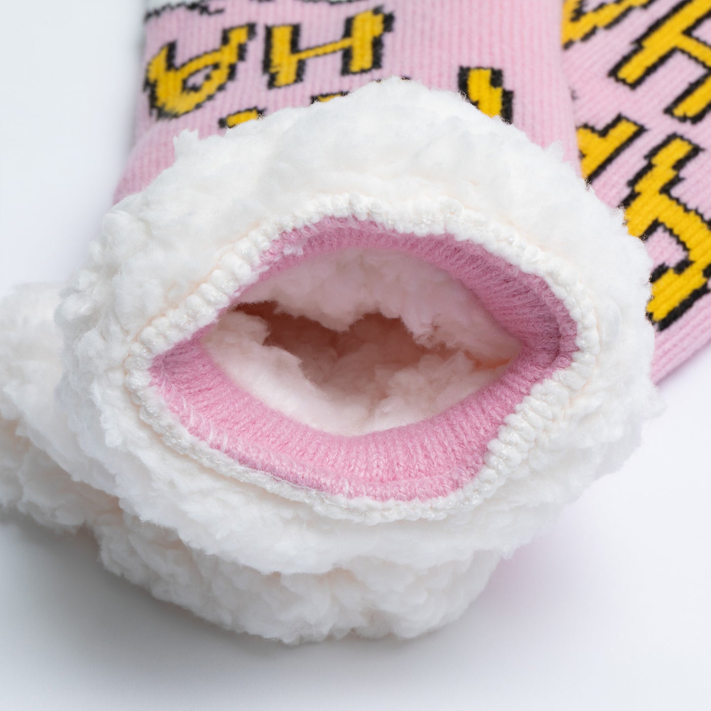 Close-up of a pink and white sock with a brand logo on a white background