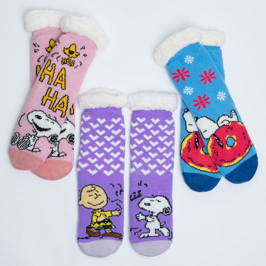 Three pairs of socks with cartoon characters on a light gray background