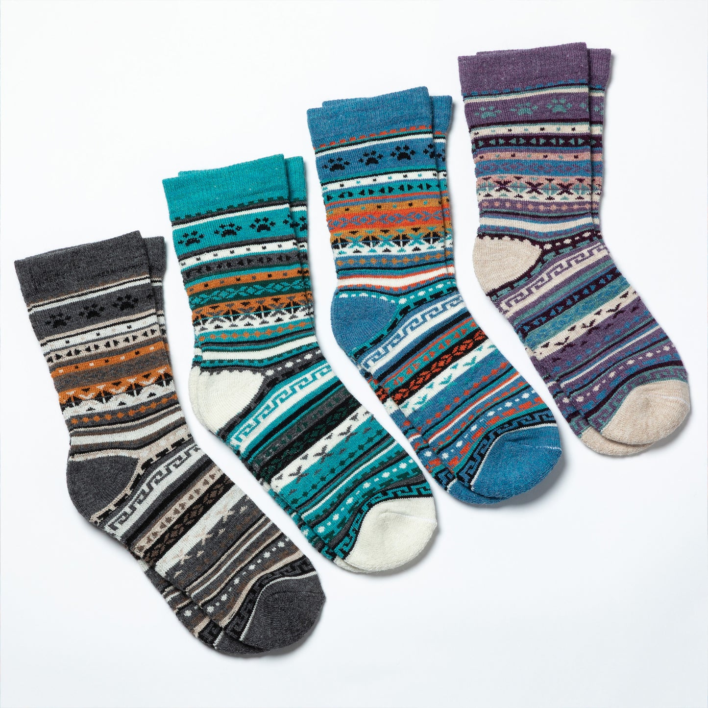 Set of four patterned socks on a white background