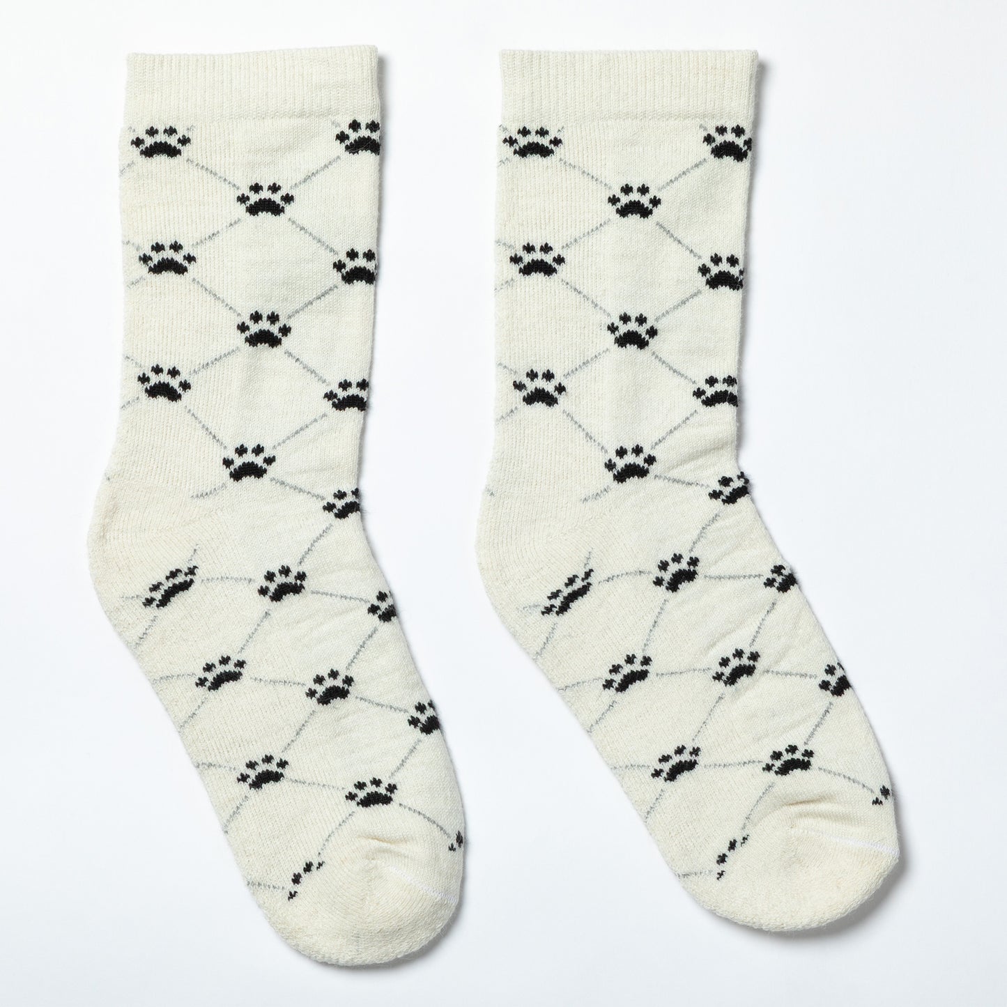 Pair of cream socks with black paw print pattern on a light gray background