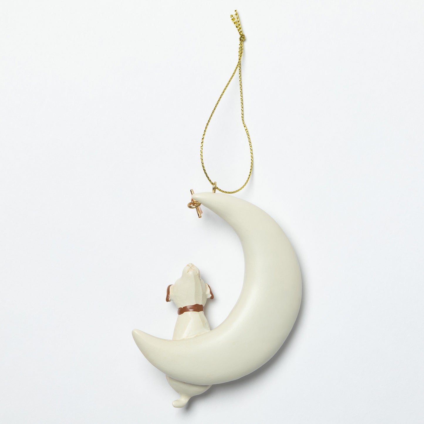 Decorative hanging ornament with a moon and dog design on a white background