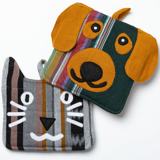 Two fabric pot holders shaped like a dog and a cat on a white background