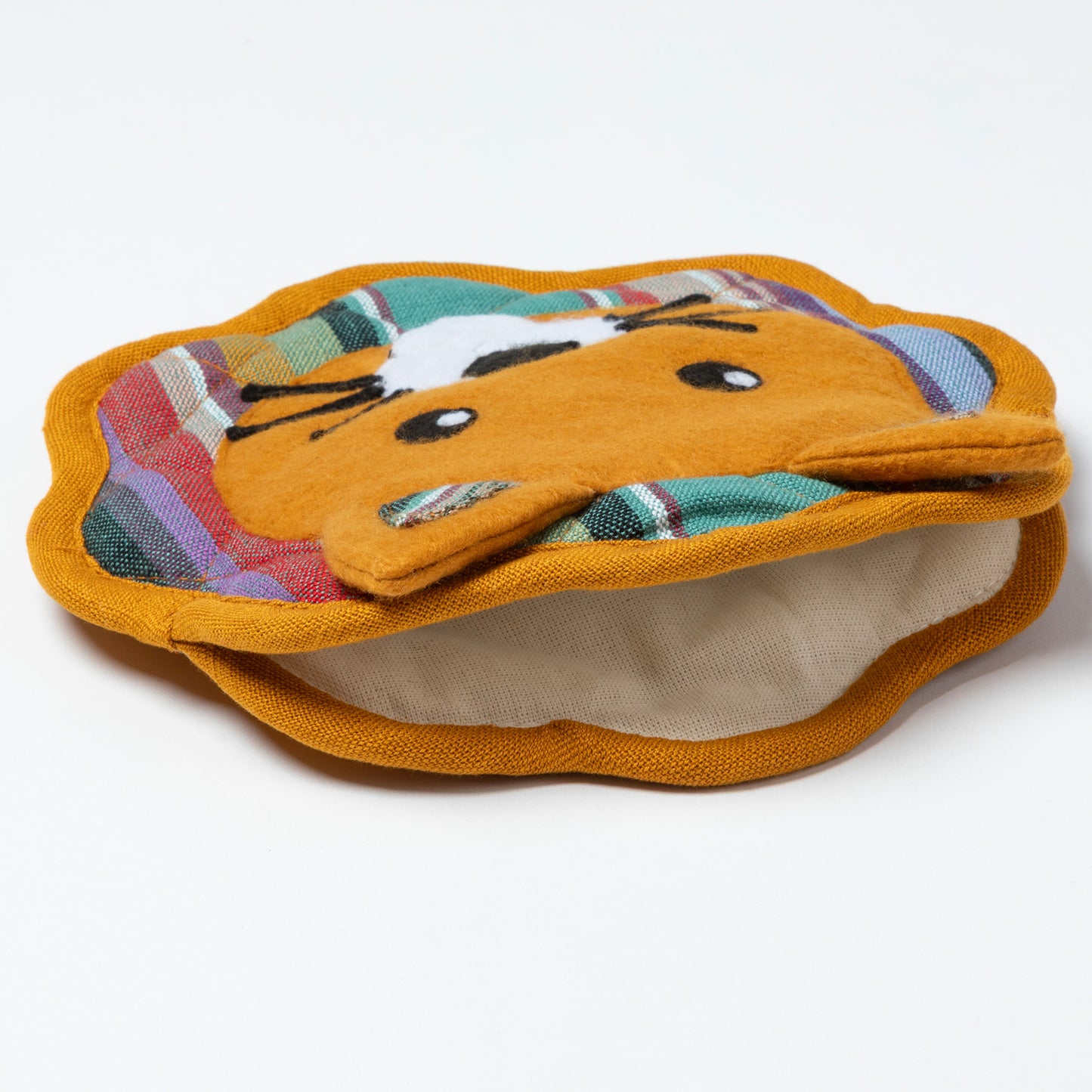 Pair of orange tortilla holders with a cartoon face design on a white background

