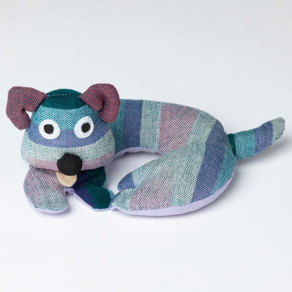 Striped dog-shaped coaster on a light gray background