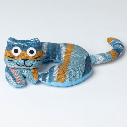 Striped cat-shaped coaster on a light gray background