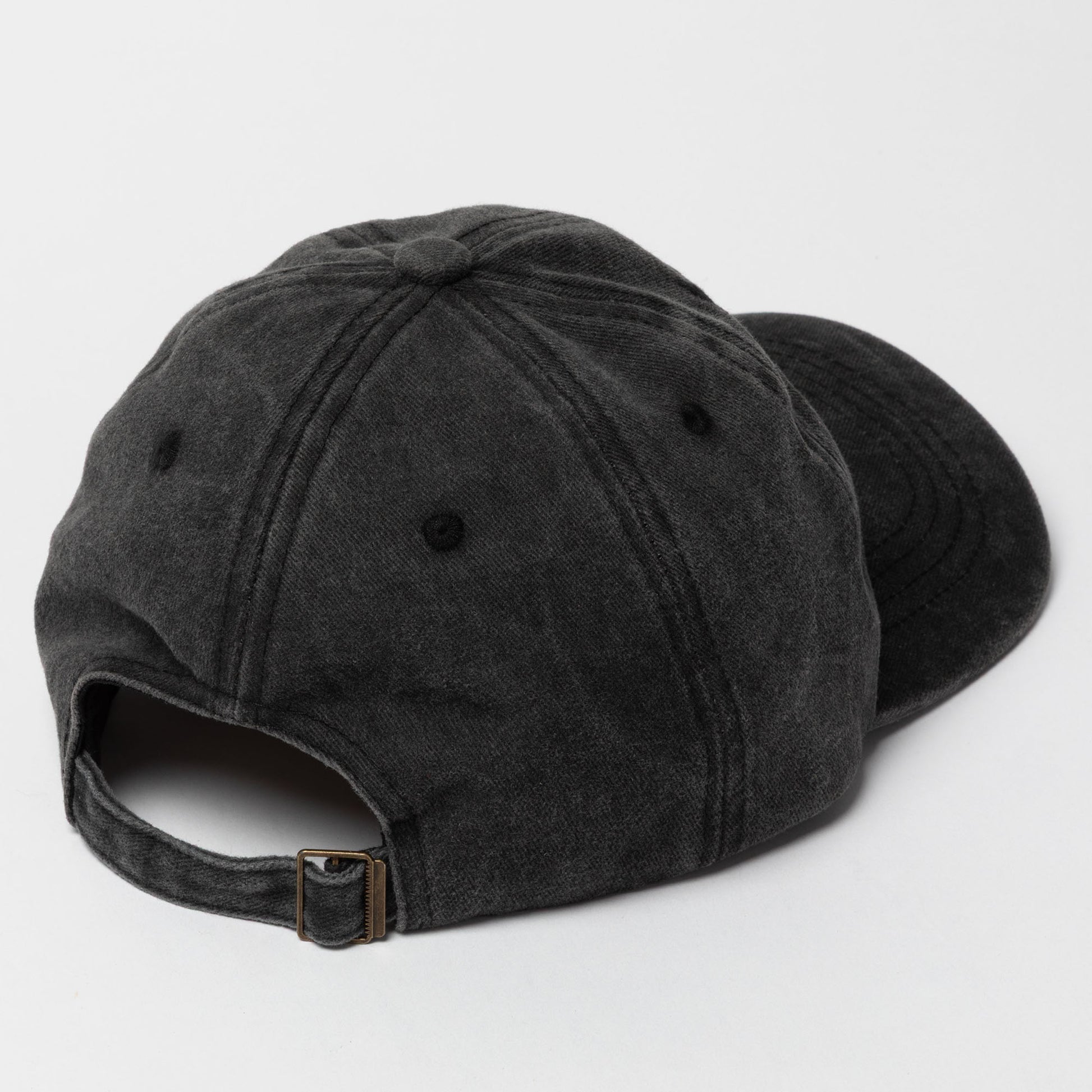 Black baseball cap on a light gray background
