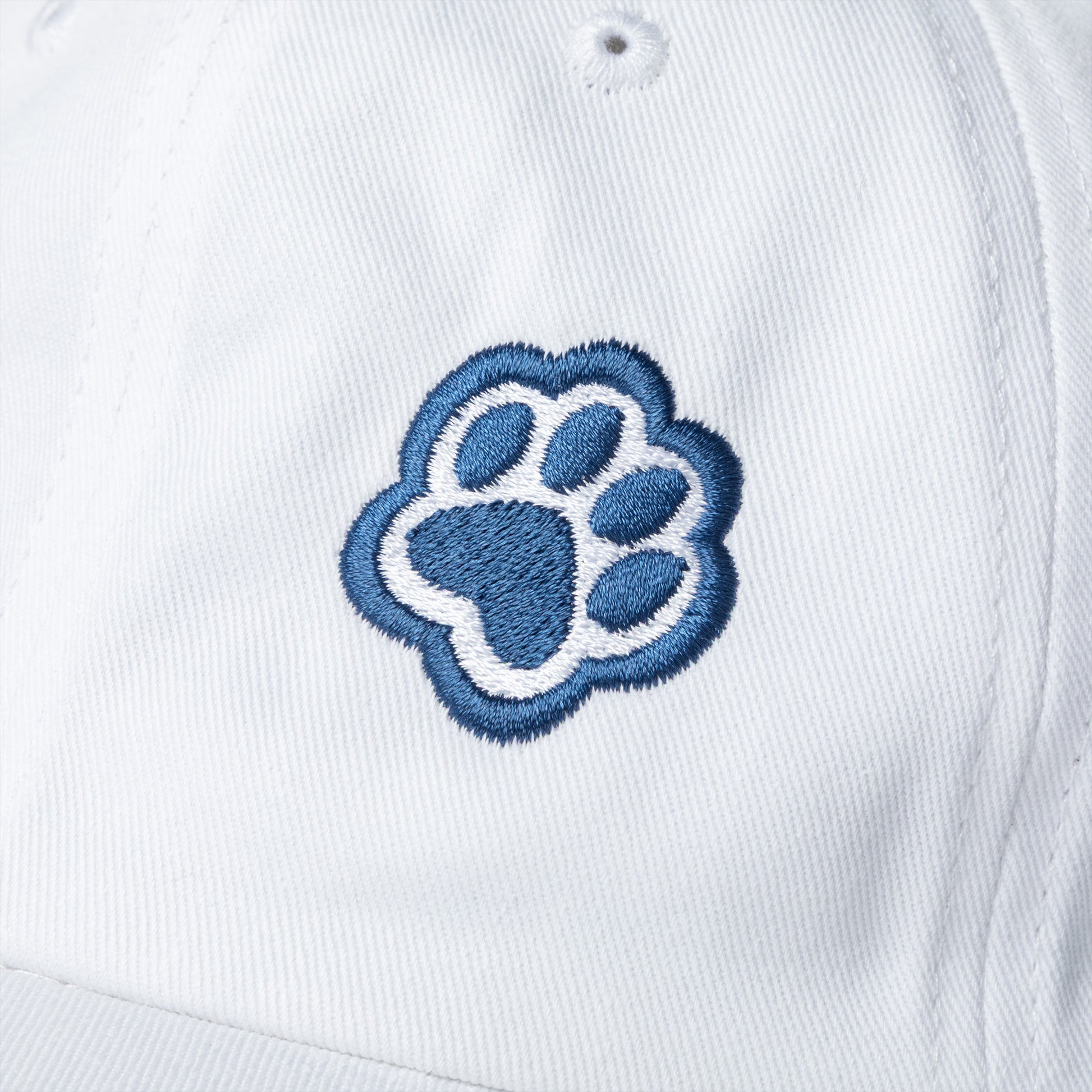 Embroidered paw prints on a white hat