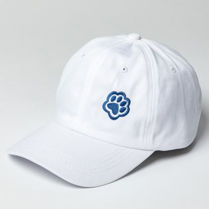White baseball cap with navy blue paw print embroidered on the front