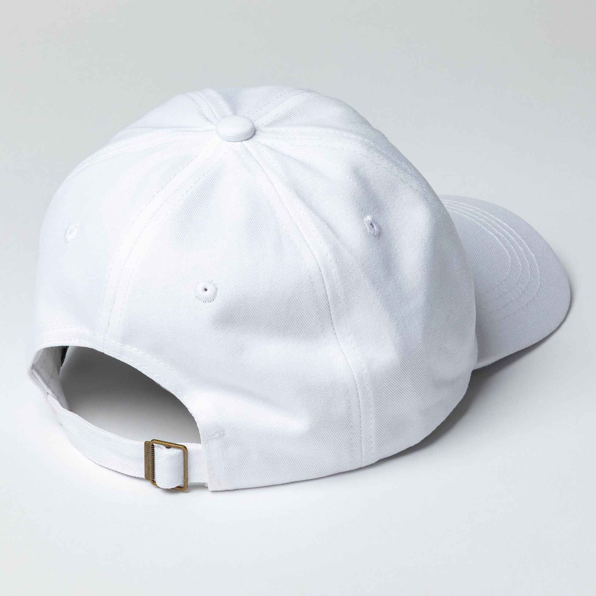 The back of a white baseball cap with a white background