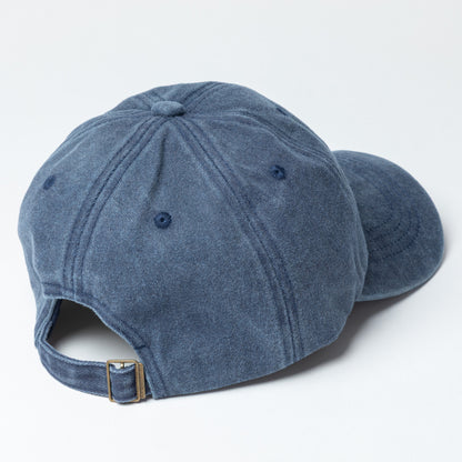 Back of a navy blue baseball cap on a light gray background