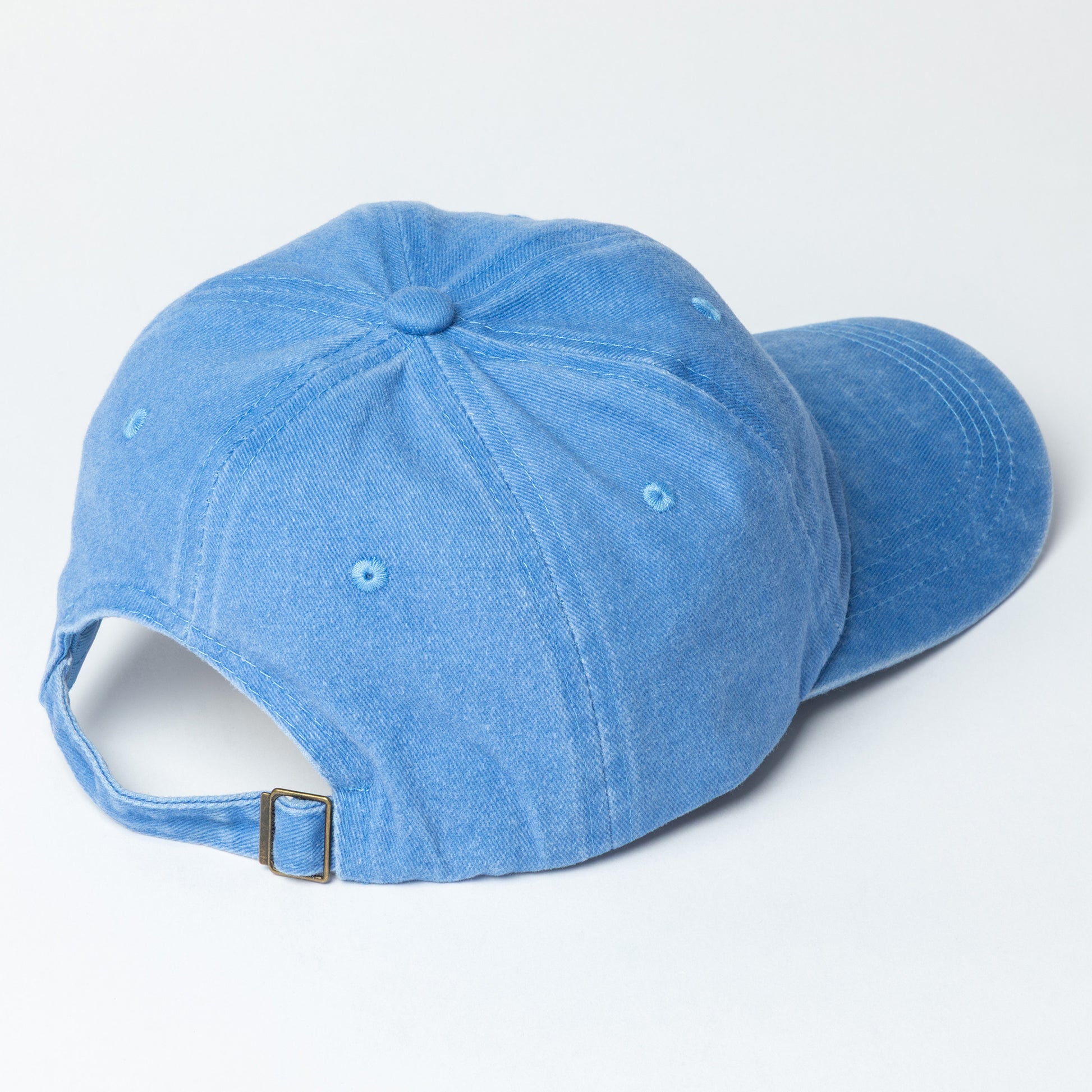 Back of a blue baseball cap with adjustable strap 