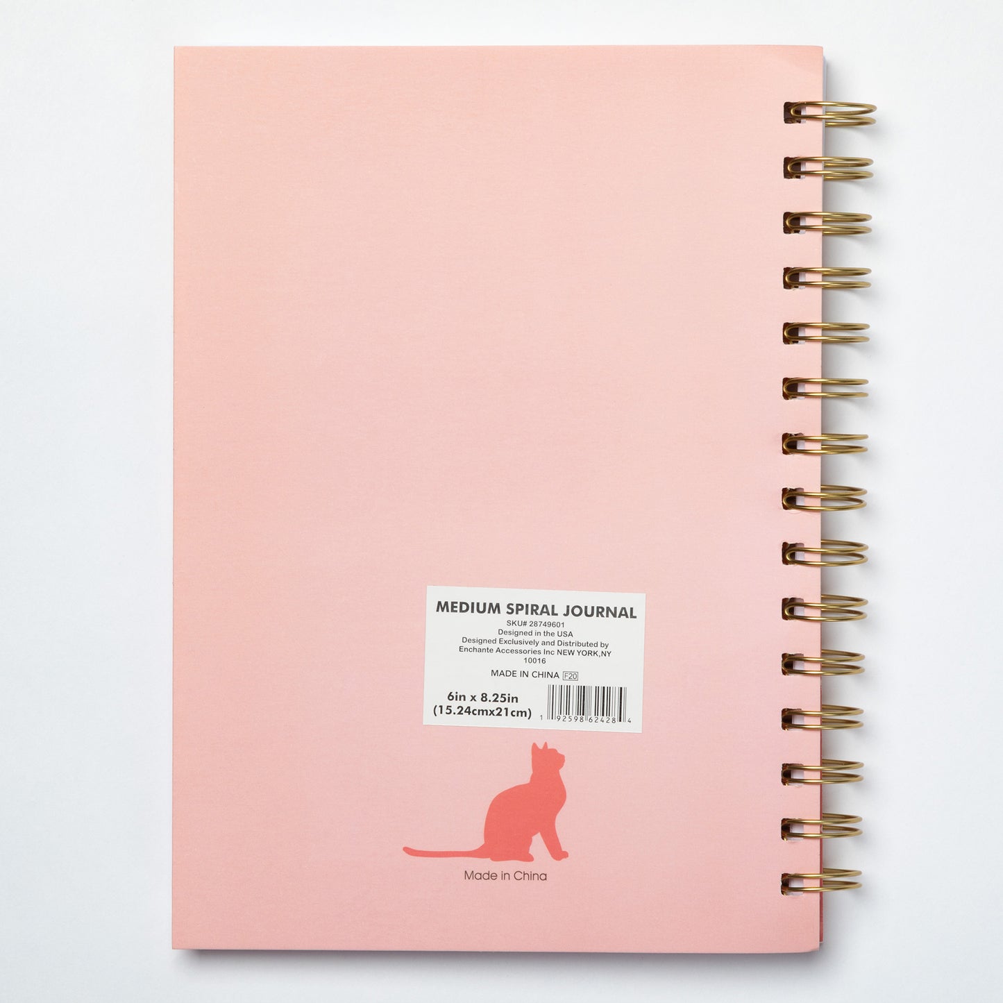 Pink medium spiral journal with a label on a white background