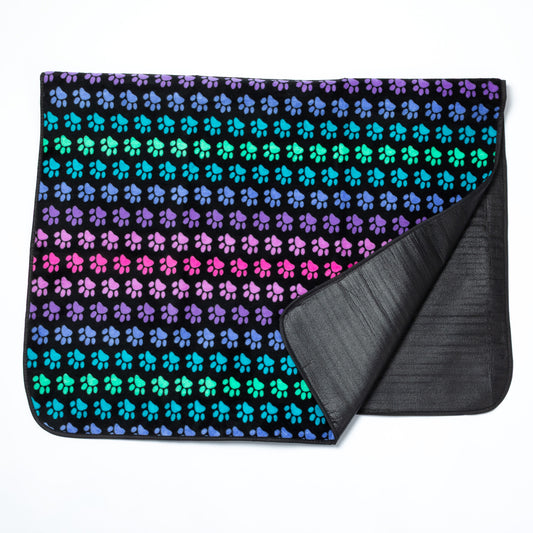 Pet blanket with colorful paw pattern on a white background.