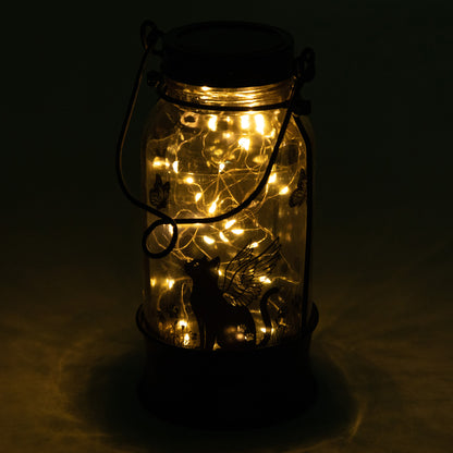 Mason jar with string lights on a dark background
